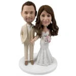 Creamy white suit groom wedding caketopper