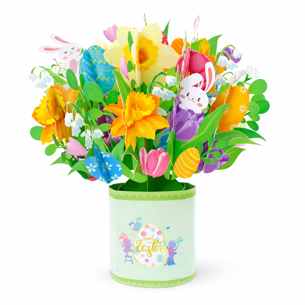 Colorful Easter bouquet of paper flowers with bunnies and eggs in a pale green pot saying 'Happy Easter' on the side.