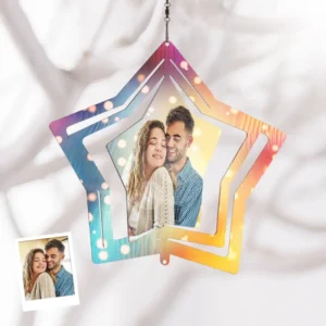 Personalized star-shaped hanging ornament with colorful gradient design featuring a couple’s photo, displayed against a soft fabric background