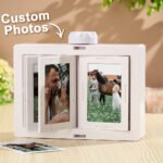 Personalized rotating photo frame box with multiple custom photo slots, displaying couple pictures inside a white tabletop display unit