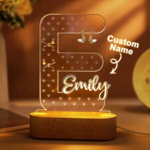 Personalized acrylic LED name lamp shaped like the letter F with the name Emily, featuring earring holders and glowing on a wooden base