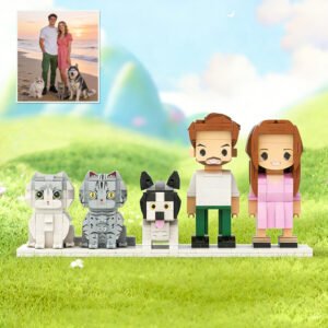Custom brick figures of a couple with pets based on a real photo, featuring two cats and one dog, displayed on a grassy background with a reference image in the corner