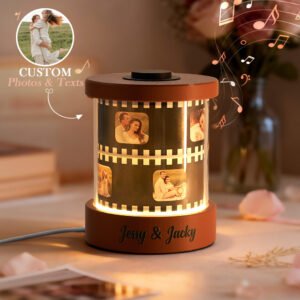 Personalized rotating photo film lamp with LED glow, featuring couple pictures on a film strip design, engraved base with names Jessy and Jacky, and custom photos and text option