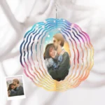 Personalized hanging wind spinner with colorful spiral design, featuring a custom couple photo at the center, displayed against a soft white background