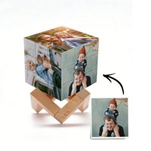 Personalized photo cube puzzle displaying family pictures on each side, placed on a wooden stand with a reference photo shown beside it